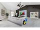 Open living room with modern fireplace, comfortable seating, and views into other living spaces at 1255 Eider Ct, Punta Gorda, FL 33950