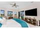 Spacious main bedroom featuring a large bed and sliding glass doors to outside at 1255 Eider Ct, Punta Gorda, FL 33950