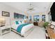 Bright main bedroom with a large windows, ceiling fan and two comfortable chairs at 1255 Eider Ct, Punta Gorda, FL 33950