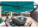 Covered outdoor dining area with table, chairs, and views of the pool and canal at 1255 Eider Ct, Punta Gorda, FL 33950