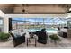 Screened in porch with seating and views of the pool and canal at 1255 Eider Ct, Punta Gorda, FL 33950