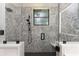 Gorgeous shower featuring tiled walls, bench seats, and black hardware at 1255 Eider Ct, Punta Gorda, FL 33950