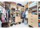 Walk-in closet with built-in shelving, hanging rods, and ample storage space for clothes and accessories at 1255 Eider Ct, Punta Gorda, FL 33950