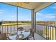 Enjoy the view from the screened-in balcony, furnished with a glass-top table and wicker chairs overlooking the golf course at 14051 Heritage Landing Blvd # 536, Punta Gorda, FL 33955