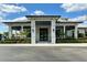 Elegant clubhouse exterior with well-manicured landscaping, providing a welcoming entrance for residents and guests at 14051 Heritage Landing Blvd # 536, Punta Gorda, FL 33955