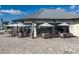 Outdoor bar and patio seating area at the clubhouse, perfect for enjoying refreshments at 14051 Heritage Landing Blvd # 536, Punta Gorda, FL 33955