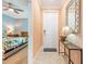 Inviting home entryway with stylish console table and view into the bedroom at 14051 Heritage Landing Blvd # 536, Punta Gorda, FL 33955