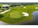Beautiful community golf course with lush green fairways, sand traps, and a tranquil pond at 14051 Heritage Landing Blvd # 536, Punta Gorda, FL 33955