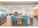 Bright kitchen featuring white cabinets, stainless steel appliances, and a granite-topped island at 14051 Heritage Landing Blvd # 536, Punta Gorda, FL 33955