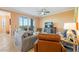 Cozy living room with plush seating, TV, and sliding doors to the outdoor balcony at 14051 Heritage Landing Blvd # 536, Punta Gorda, FL 33955