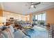 Cozy living room with comfortable sofas, open to the kitchen and balcony at 14051 Heritage Landing Blvd # 536, Punta Gorda, FL 33955