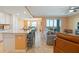 Open-concept layout connecting the kitchen, dining area, and living room, with balcony access at 14051 Heritage Landing Blvd # 536, Punta Gorda, FL 33955