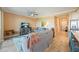 Open concept living area features comfortable seating, a TV, and access to the kitchen and dining area at 14051 Heritage Landing Blvd # 536, Punta Gorda, FL 33955