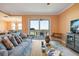 Inviting living room with comfortable seating and a sliding glass door to the balcony at 14051 Heritage Landing Blvd # 536, Punta Gorda, FL 33955