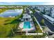Community pool with a pavilion, lounge chairs, and palm trees, creating a relaxing resort-style atmosphere at 14051 Heritage Landing Blvd # 536, Punta Gorda, FL 33955