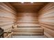 Home sauna with wooden benches, walls, and flooring, offering a peaceful retreat at 14051 Heritage Landing Blvd # 536, Punta Gorda, FL 33955