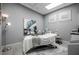 Relaxing treatment room with a massage table, soft lighting, and soothing decor at 14051 Heritage Landing Blvd # 536, Punta Gorda, FL 33955