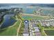 Stunning aerial view of new homes in a lakeside community with golf course at 15830 Appalachian Dr, Punta Gorda, FL 33982
