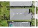 Aerial view of the property with a well-maintained roof, landscaping, and proximity to neighboring homes at 15830 Appalachian Dr, Punta Gorda, FL 33982