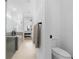 Bathroom offers tile flooring, glass shower, toilet, and a glimpse into the bedroom at 15830 Appalachian Dr, Punta Gorda, FL 33982
