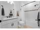 Beautiful bathroom featuring a large vanity, a shower with a tub, and a toilet with all-white fixtures at 15830 Appalachian Dr, Punta Gorda, FL 33982