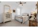 Cozy bedroom featuring a charming bed, vintage vanity, and ample natural light creating a warm and inviting atmosphere at 15830 Appalachian Dr, Punta Gorda, FL 33982