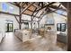 Spacious clubhouse interior with exposed beams, stone fireplace, large island, and ample seating at 15830 Appalachian Dr, Punta Gorda, FL 33982