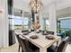 Dining room offers views of a lake and has modern decor and bright, natural light at 15830 Appalachian Dr, Punta Gorda, FL 33982