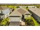 Stunning aerial view of a well-kept home with a lush green lawn, picturesque landscaping and charming neighborhood views at 15830 Appalachian Dr, Punta Gorda, FL 33982