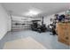 Spacious garage featuring a golf cart, bike, and ample storage space at 15830 Appalachian Dr, Punta Gorda, FL 33982