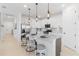 Bright kitchen features a large island with bar seating and modern stainless steel appliances at 15830 Appalachian Dr, Punta Gorda, FL 33982