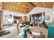 Inviting lounge area featuring vaulted ceilings, leather seating, and access to an outdoor patio at 15830 Appalachian Dr, Punta Gorda, FL 33982