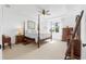 Spacious main bedroom boasts neutral decor, tray ceilings, and comfortable, carpeted floors at 15830 Appalachian Dr, Punta Gorda, FL 33982