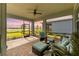 Relaxing screened-in patio has comfortable seating and stunning views of the golf course at 15830 Appalachian Dr, Punta Gorda, FL 33982