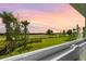 Beautiful sunset view overlooks the golf course and pond at 15830 Appalachian Dr, Punta Gorda, FL 33982
