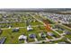 Aerial view shows the proximity to amenities and the property's location in a residential area at 16031 Quinta Dr, Punta Gorda, FL 33955