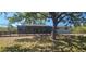 Home's partially fenced backyard with water access at 17356 Gulfspray Cir, Port Charlotte, FL 33948
