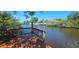 Water view from backyard deck, showcasing waterfront lifestyle at 17356 Gulfspray Cir, Port Charlotte, FL 33948