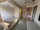 Spacious bathroom featuring a bathtub, vanity, and tiled flooring at 17356 Gulfspray Cir, Port Charlotte, FL 33948