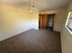 Comfortable bedroom featuring carpet, ceiling fan, and closet at 17356 Gulfspray Cir, Port Charlotte, FL 33948