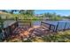Wooden dock overlooking tranquil waters, perfect for relaxing or fishing at 17356 Gulfspray Cir, Port Charlotte, FL 33948