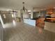 Open-concept layout featuring tile flooring connecting the living, dining, and kitchen areas at 17356 Gulfspray Cir, Port Charlotte, FL 33948
