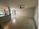 Open-concept living room showcasing tile floors, ample natural light, and a seamless flow at 17356 Gulfspray Cir, Port Charlotte, FL 33948