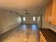 Large living room featuring tile floors, a ceiling fan, and natural light from the windows at 17356 Gulfspray Cir, Port Charlotte, FL 33948