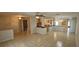 Open concept living room with tile flooring, ideal for relaxing and entertaining guests at 17356 Gulfspray Cir, Port Charlotte, FL 33948