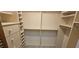 Well-organized walk-in closet featuring shelving, drawers, and ample storage space at 17356 Gulfspray Cir, Port Charlotte, FL 33948