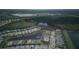 Aerial view of a community with lake, and luscious green landscape and beautiful homes at 1745 Hyssop Loop, North Port, FL 34289