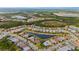 An aerial view of the community showcasing lush landscape, mature trees, and lakes at 1745 Hyssop Loop, North Port, FL 34289