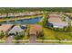 An aerial view of a lovely home on a landscaped lot in a community with lakes at 1745 Hyssop Loop, North Port, FL 34289