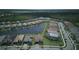 Beautiful aerial view of the community featuring well-maintained homes and a serene lake at 1745 Hyssop Loop, North Port, FL 34289
